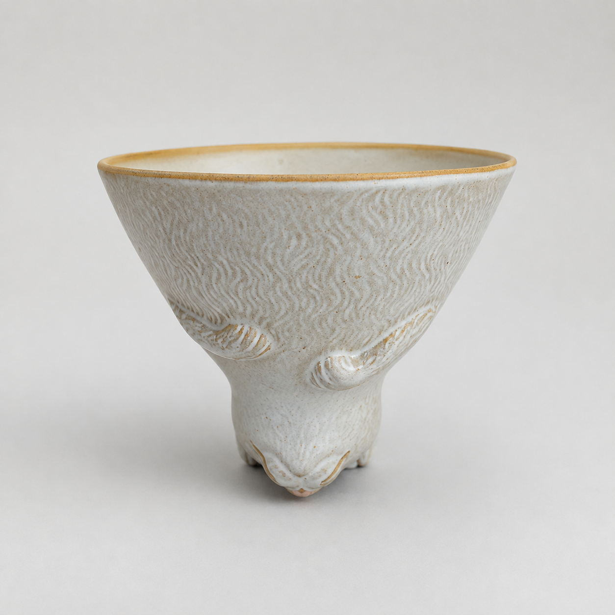 Ivory cat ceramic cup: front with cup opening facing up