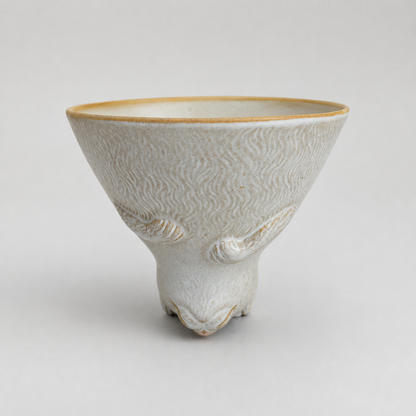 Ivory cat ceramic cup: front with cup opening facing up