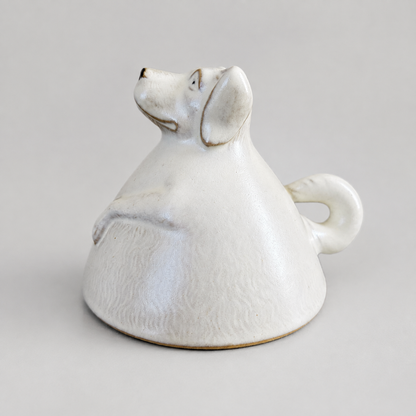 Ivory dog ceramic cup: inverted animal display