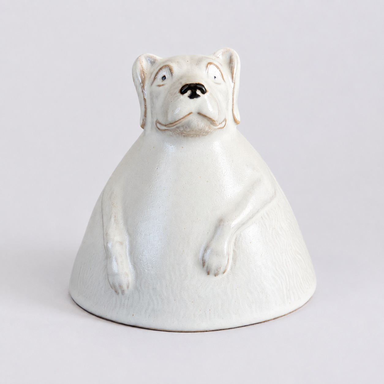 Ivory dog ceramic cup: front of animal-shaped display