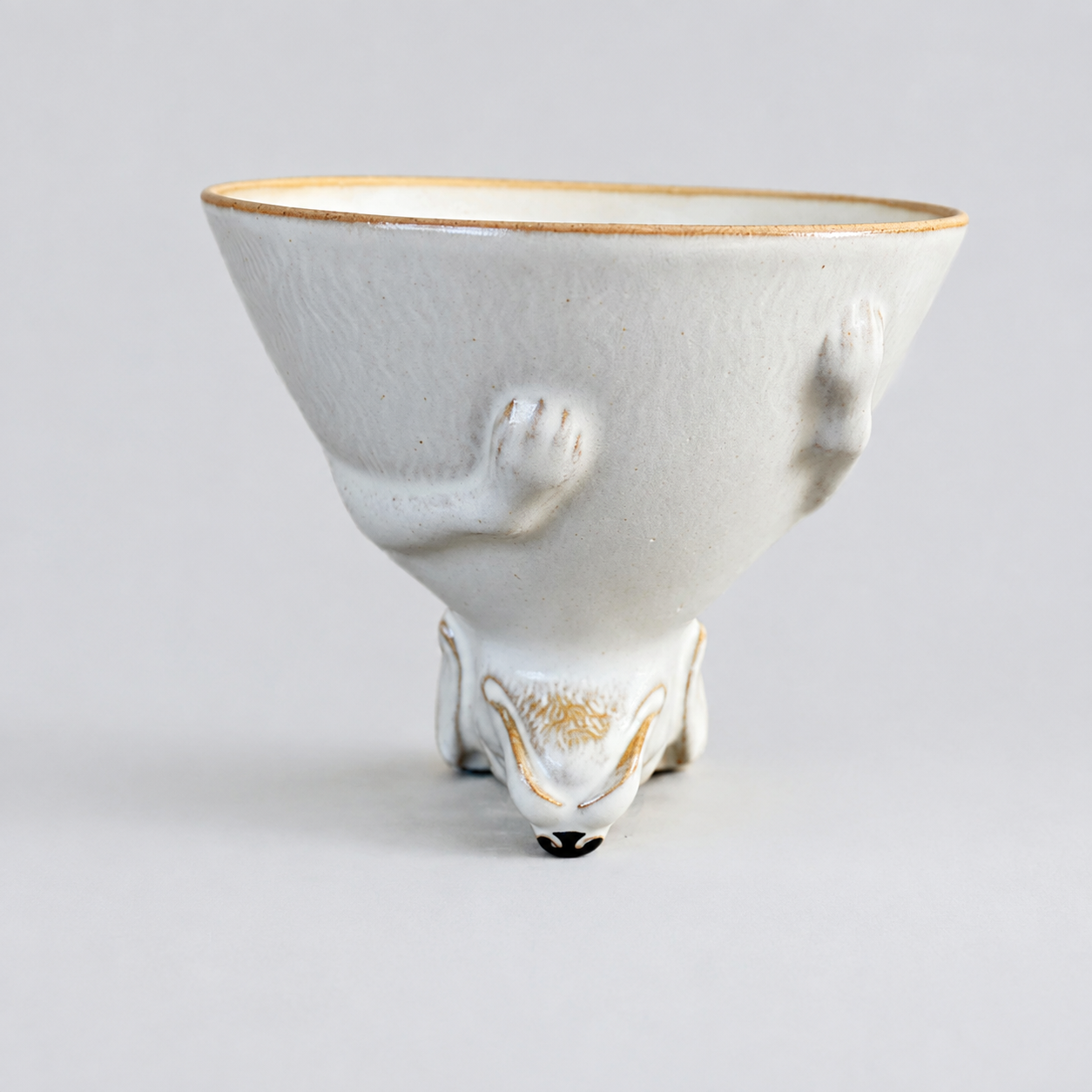 Ivory dog ceramic cup: front with cup opening facing up