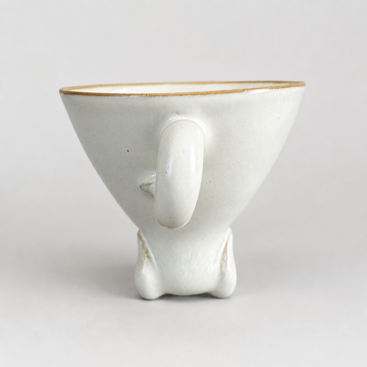 Ivory dog ceramic cup: rear and tail-shaped handle
